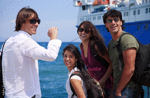 Photo: Group of friends in front of ferry Group of friends in front of ferry