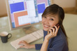 Smiling woman using computer