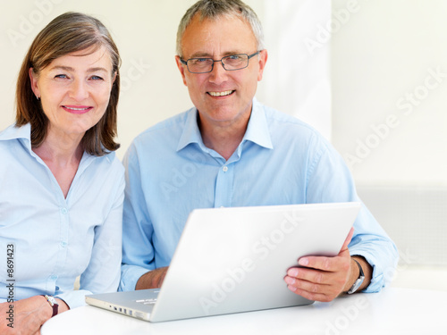 Happy old couple using laptop Happy old couple using laptop