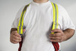Foto: Midsection of a man wearing suspenders for a Fireman. Midsection of a man wearing suspenders for a Fireman.
