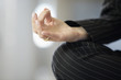 Close up of a woman's hand doing yoga.