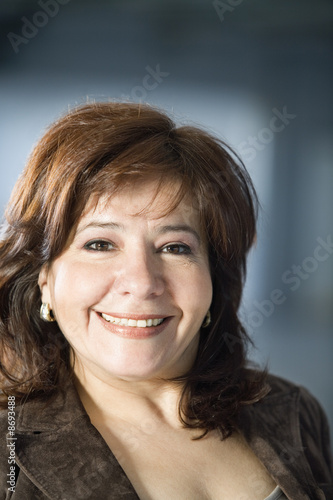 Photo: Portrait of a smiling woman. Portrait of a smiling woman.