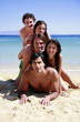 Group of friends piling into a pyramid