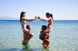 Group of friends playing in the water