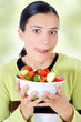 young beautiful woman eating healthy food - salad
