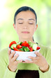 young beautiful woman eating healthy food - salad