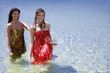 Two young women posing in water