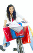 happy young lady on bike returning from shopping