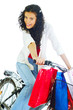 happy young lady on bike returning from shopping