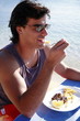 Young man eating at a restaurant