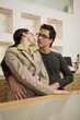 Couple about to kiss in eyeglasses store