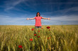young girl with red clown nose outdoors