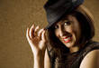 Hispanic Woman Tipping Her Hat
