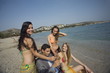 Businessman on beach with three women