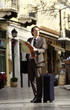 Businessman with a map *** Local Caption *** Business people enjoying the relaxed environment of the Southern European way of doing business