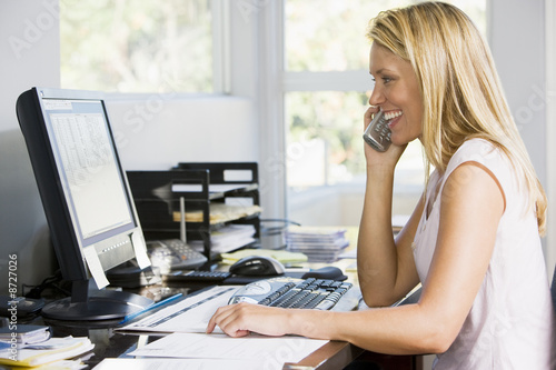  Computer Phone on Woman In Home Office With Computer Using Telephone Smiling    Monkey