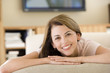 Photo: Woman lying in living room Woman lying in living room
