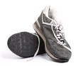 Old grungy Running Shoes isolated on white background