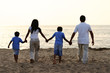Family Holding Hands at the Beach Together Family Holding Hands at the Beach Together
