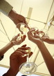 Hands with champagne glasses toasting