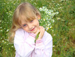 Photo: Little girl with the bouquet of camomiles. Little girl with the bouquet of camomiles.