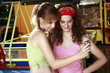 Female teenagers taking picture of themselves with cell phone camera