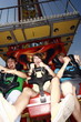 Teenagers on amusement park ride