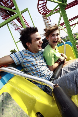 Photo: Teenage couple on amusement park ride Teenage couple on amusement park ride