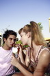Teenage couple sharing a soda