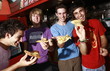Male teenagers hanging out;eating pizza