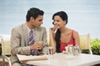 Couple at seaside cafe table
