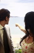 Business man and woman pointing
