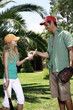 Father and daughter with baseball outfit
