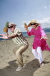 Photo: Senior couple with pineapples on the beach Senior couple with pineapples on the beach