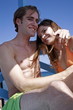 Young adult couple embracing on beach