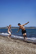 Father and daughter playing on beach