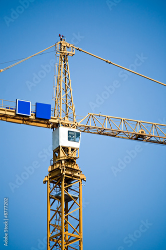 Photo: crane tower against blue sky crane tower against blue sky