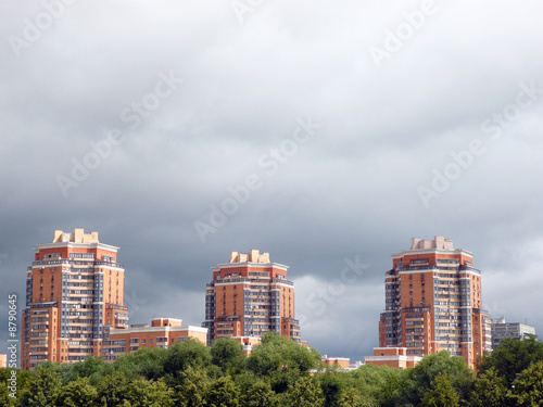 Photo: building and lowering clouds building and lowering clouds