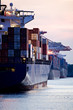 container cargo ships docked in port - three freighters sunset container cargo ships docked in port - three freighters sunset
