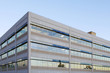An office building with a empty parking lot An office building with a empty parking lot