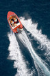 family into fast driving boat on the sea family into fast driving boat on the sea