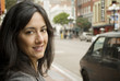 Portrait of a business woman on a city street