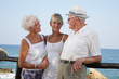 proud grandparents smiling at their granddaughter