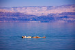 Man floating at the Dead Sea, Israel Man floating at the Dead Sea, Israel