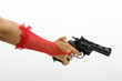 The woman hand with pistol