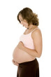 Caucasian woman who is 9 months pregnant on white background