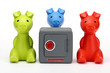 Foto: Three little pigs guarding a safe Three little pigs guarding a safe