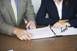 Foto: View of two people working in an office. View of two people working in an office.