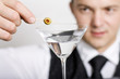 Barman with drink.