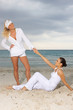 Two young women spending time at the beach